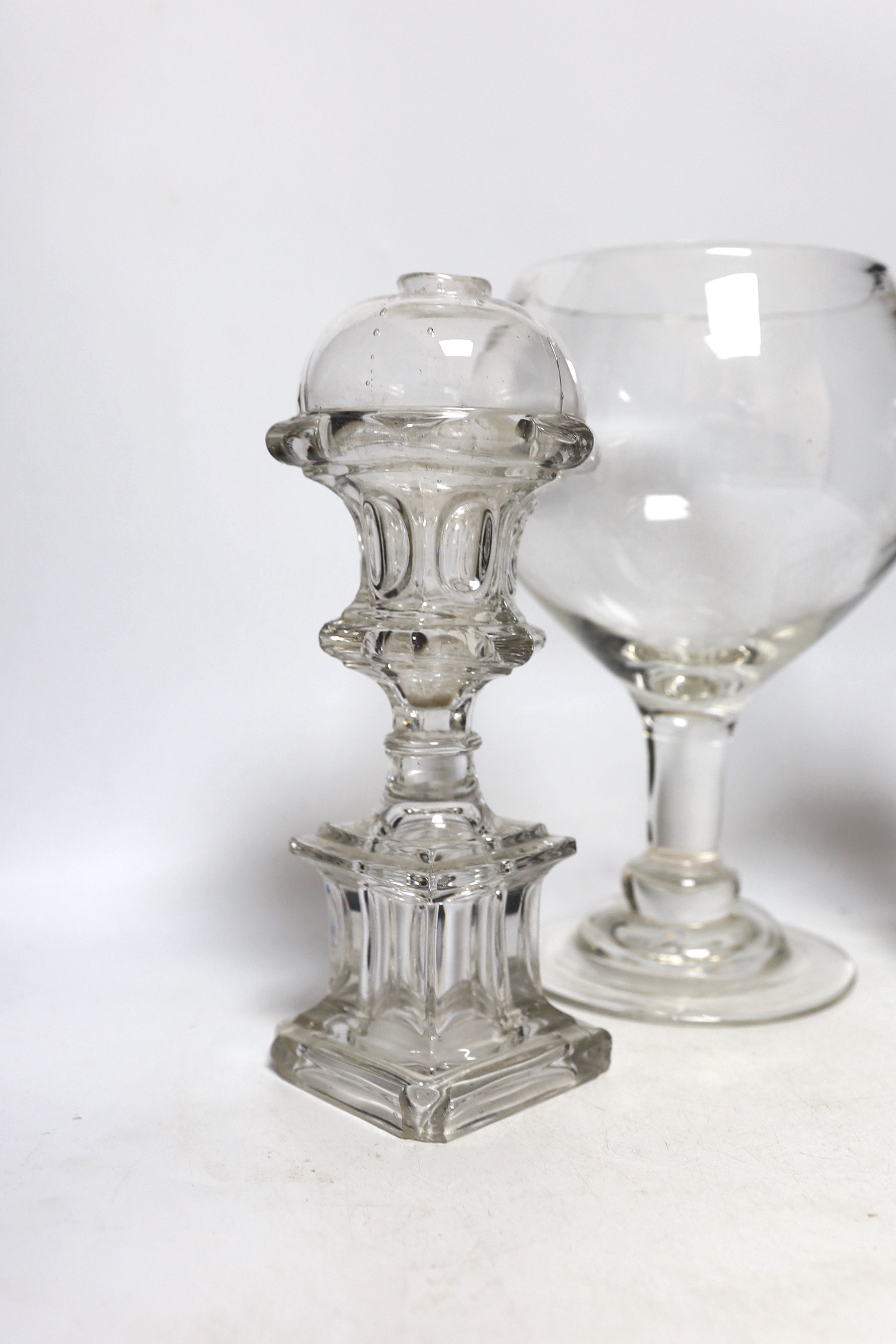 A pair of Victorian glass lamp bases and a goblet vase, largest 30cm